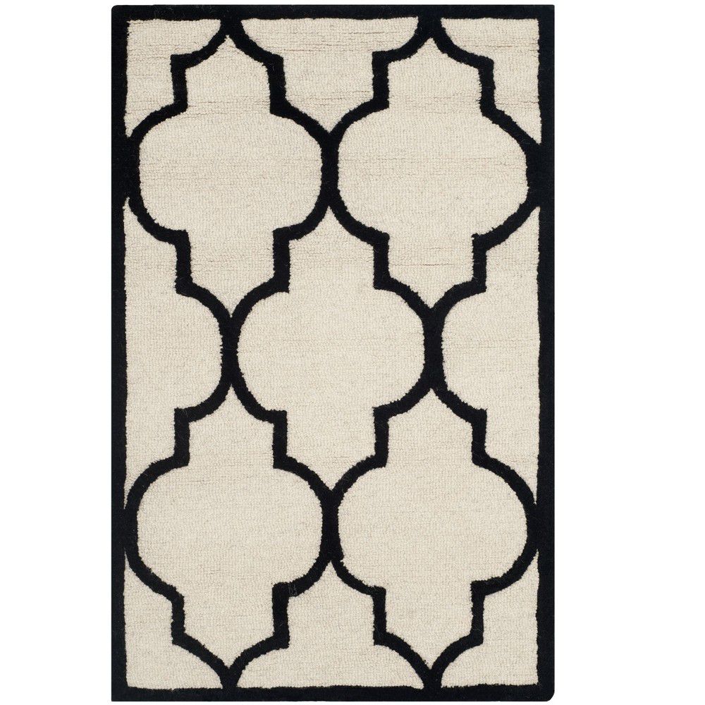 Vlněný koberec v krémově bílé a černé barvě Safavieh Everly 121 x 182 cm - Bonami.cz