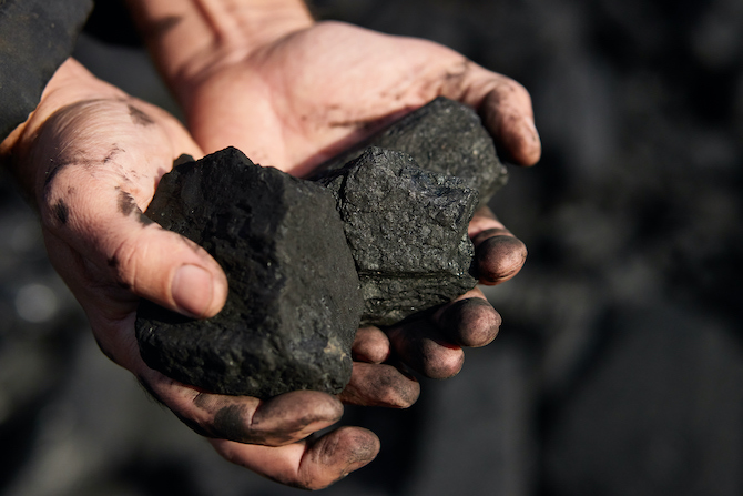 poor-middleaged-man-holding-hands-stone-coal-sale-provide-food-his-family (2).jpg - 