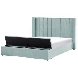 Sametová postel s úložným prostorem 180 x 200 cm mátově zelená NOYERS